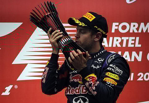 Sealed with a kiss, Vettel to the fore