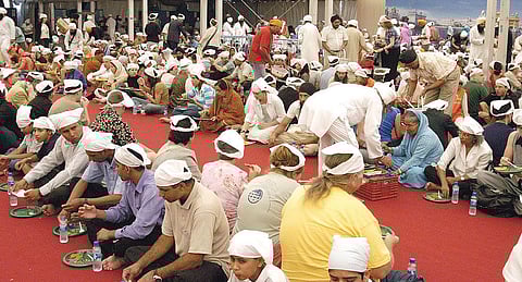 Slump Sends Jobless to Sikh Kitchens Abroad