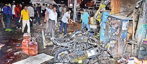 12 dead, 84 hurt in twin bomb blasts