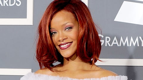 Rihanna kisses mystery man