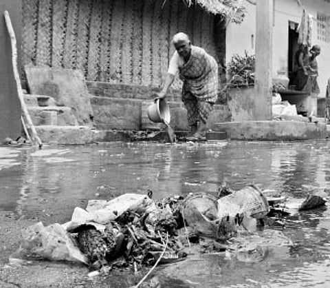 Shenbakkam residents clean up blocked drain