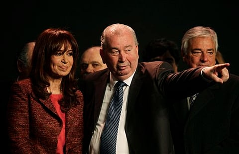 2009 file photo, Argentina's President Cristina Fernandez with Julio Grondona, president of the Argentine Football Association (AP Photo/Natacha Pisarenko, File)