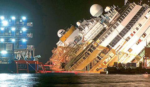 Costa Concordia Limps Back to its Birth City