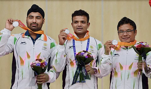 Silver medalist Vijay Kumar Tamang Pemba Gurpreet Singh in men's 25m Center pistol event during a victory ceremony at the Ongnyeon International Shooting Range at the 17th Asian Games in Incheon South Korea on Friday | PTI