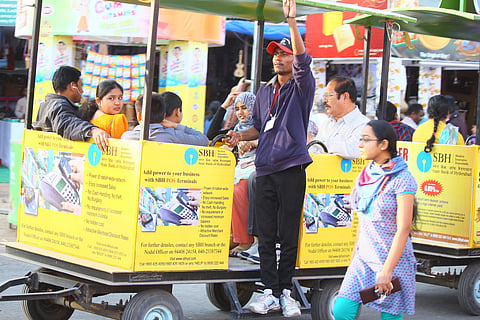 Volunteers Help Exhibition Visitors