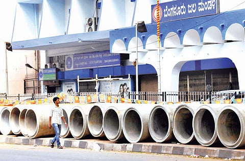 Pipes on Footpath, Pedestrians on the Road