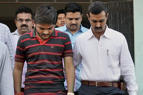 Convener of Patidar Anamat Andolan Samiti Hardik Patel is taken to the court in Surat. |PTI
