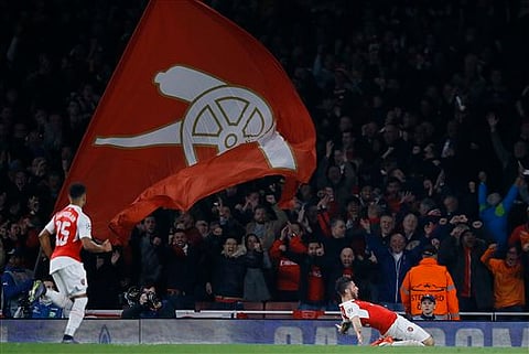 Arsenal's Olivier Giroud, right, celebrates after scoring during the Champions League Group F soccer match between Arsenal and Bayern Munich at Emirates stadium in London. | AP