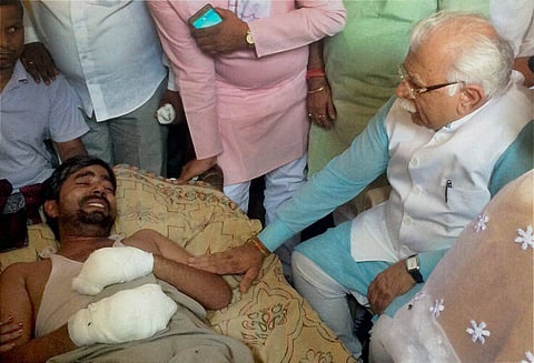 Haryana Chief Minister Manohar Lal Khattar meeting Jitendra whose house was set on fire allegedly by men belonging to the upper-cast community at Supedh village in Ballabhgargh in Faridabad on October 22. | PTI