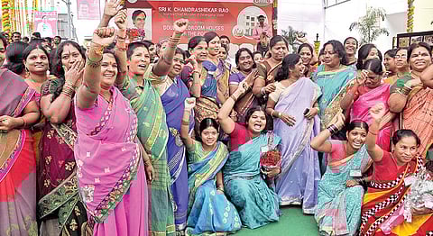 Poor women beneficiaries in jubiliant mood as they are going to become owners of 2-BHK flats at IDH Colony in Hyderabad on Monday. |A RAdhakrishna