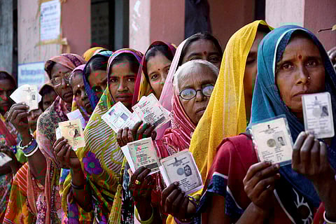 Women voters wait in a queue to cast their votes during fourth phase of Bihar elections in Muzaffarpur. |PTI