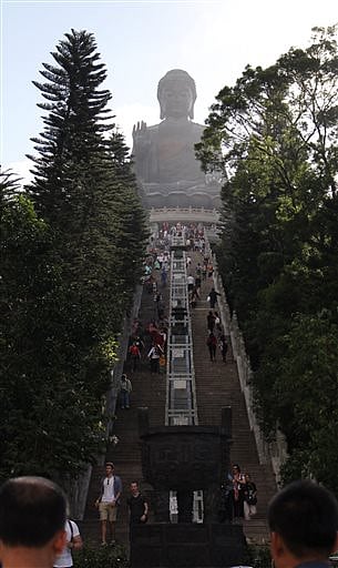 This Nov. 15, 2015 photo shows the staircase that leads to the giant Tian Tan Buddha statue in Ngong Ping Village, Hong Kong. Ngong Ping is also home to the Po Lin Monastery and visitors worship throughout the grounds. | AP