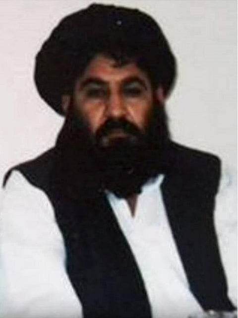 This handout photograph released by The Afghan Taliban on December 3, 2015, which was taken on a mobile phone in mid-2014 is said to show Afghan Taliban leader Mullah Akhtar Mansour posing for a photograph. |AFP