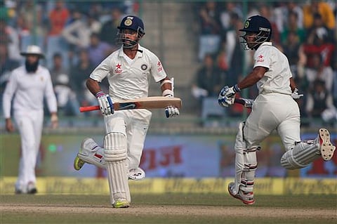 India's Ajinkya Rahane, and Wriddhiman Saha, right, score runs against South Africa on day four of their fourth and final test cricket match in New Delhi, India, Sunday, Dec. 6, 2015. | AP