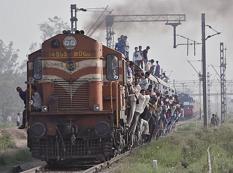 Passengers travel on an overcrowded train at Loni town in the northern Indian state of Uttar Pradesh. | Reuters/File Photo