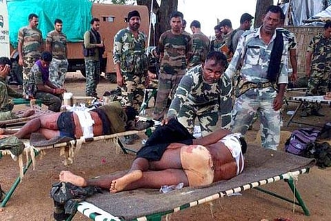 Injured jawans of Special Task Force being provided medical help after an encounter with Maoists in Pedmal forest in Chhattisgarh's Sukma district on Saturday. (PTI Photo)