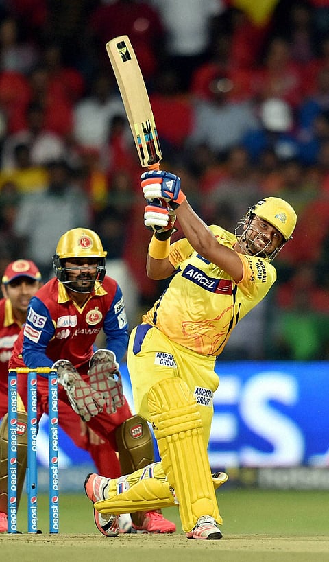 Chennai Super Kings Suresh Raina plays a shot during IPL 8 against Royal Challengers Bangalore match at Bengaluru on Wednesday | PTI