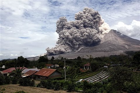 Children watch the Calbuco volcano erupt, from Puerto Varas, Chile. |AP