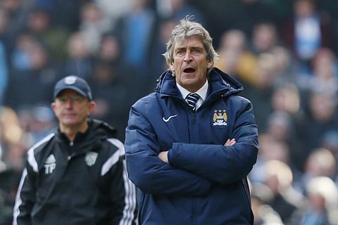 Manchester City manager Manuel Pellegrini and West Bromwich Albion manager Tony Pulis. (Reuters)