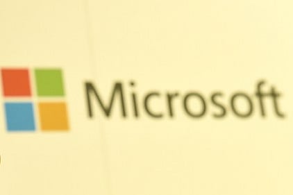 A man shows Microsoft's Windows 10 operating system at the CeBIT technology fair in Hanover on March 15, 2015. (AFP)