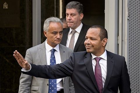 Neymar Da Silva Santos (R), father of Barcelona's player Neymar, waves to journalists as he leaves the Spanish National Court in Madrid. |AFP