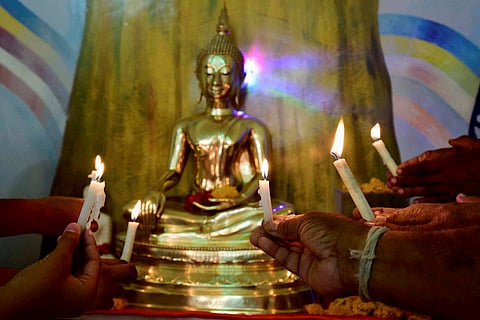 Buddhist community members offering prayer to Lord Buddha on the occasion of Buddha Purnima in Bhopal on Monday. (PTI)