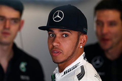 Mercedes driver Britain's Lewis Hamilton stands inside his box during the second practice session for the Spain Formula One Grand Prix at the Barcelona Catalunya racetrack in Montmelo, just outside Barcelona, Spain, Friday| AP