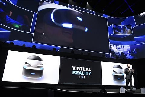 Andrew House, bottom right, president and global CEO of Sony Computer Entertainment Inc., talks about the Sony Morpheus virtual reality headset at the Sony Playstation at E3 2015 news conference at the Los Angeles Sports Arena. |AP
