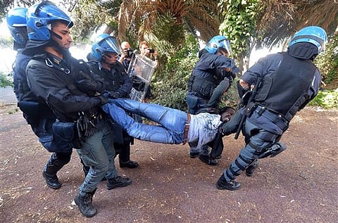 Police in Helmets Drag Migrants From French-Italian Border