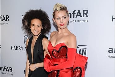 Honoree Miley Cyrus, right, arrives with friend Tyler Ford at the 6th Annual amfAR New York Inspiration Gala at Spring Studios. |AP