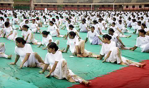 Amid Rain, Odisha Stretches on World Yoga Day
