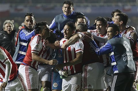 Paraguay's players celebrate after the penalty shootout during a Copa America quarterfinal soccer match at the Ester Roa Rebolledo Stadium in Concepcion, Chile. |AP