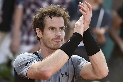 Great Britain's Andy Murray celebrates after winning his match against Spain's David Ferrer during the men's quarter-finals of the Roland Garros 2015 French Tennis Open in Paris. |AFP