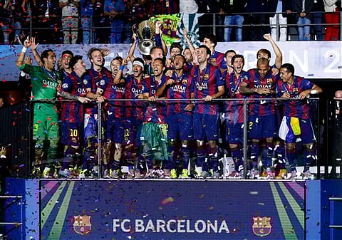 Barcelona players celebrate with the trophy after the Champions League final soccer match between Juventus Turin and FC Barcelona at the Olympic stadium in Berlin | AP