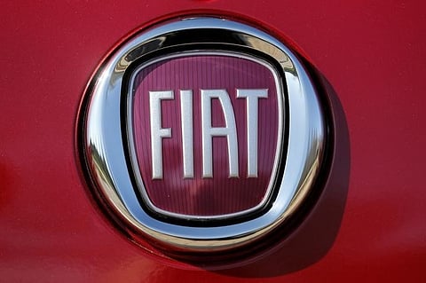 The Fiat logo is seen on a Fiat vehicle displayed outside Chrysler World Headquarters during the FCA Investors Day in Auburn Hills, Michigan May 6, 2014. | REUTERS