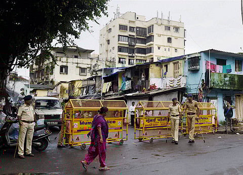 Mumbai Police personnel stand guard outside Yakub Memon's house in Mumbai on Thursday. Memon convicted for the 1993 blasts in Mumbai was hanged a little before 7 am at Nagpur Central Prison on Thursday.