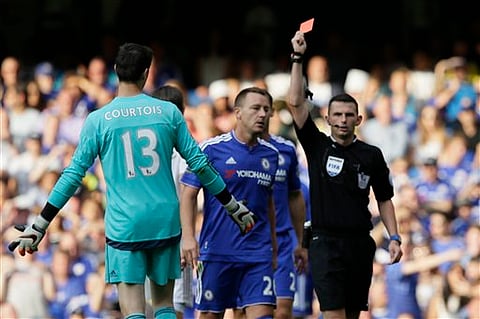 Chelsea’s Thibaut Courtois is given a red card by referee Michael Oliver during the English Premier League soccer match between Chelsea and Swansea City at Stamford Bridge, London | File/AP