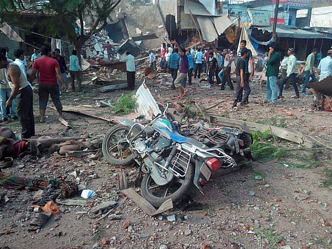 Damaged motorcycles lying near a collapsed restaurant where a cooking gas cylinder exploded in Petlawad town in Jhabua district of Madhya Pradesh on September 12. | PTI