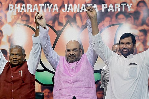 BJP President Amit Shah with HAM S chief Jitan Ram Manjhi and LJP President Ramvilas Paswan during a press conference regarding Bihar elections in new Delhi on September 14. | PTI