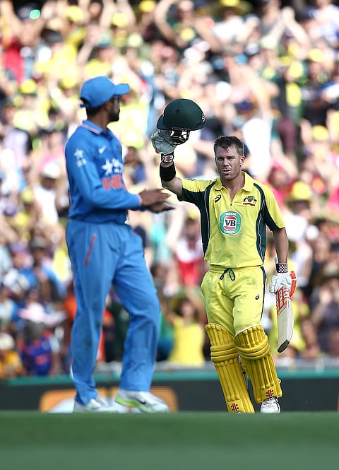 India's Ravindra Jadeja claps as Australia's David Warner celebrates after hitting a century during their One Day International cricket match in Sydney Saturday, Jan. 23, 2016. | AP