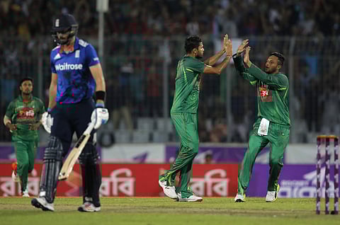 Bangladesh’s captain Mashrafe Mortaza, second right, celebrates with his teammate Shakib Al Hasan the dismissal of England’s James Vince, second left, during the second ODI. | AP