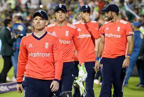 Eoin Morgan leads his players off the pitch after losing against Pakistan, after the Twenty20 match between England and Pakistan, at Old Trafford, in Manchester, England, Wednesday Sept. 7, 2016. | AP