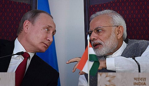 Prime Minister Narendra Modi sharing a word with Russian President Vladimir Putin at the agreement exchange ceremony after the 17th India-Russia annual summit meet in Benaulim Goa.