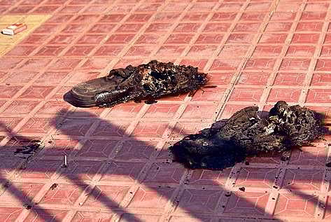 Raju’s burnt slippers lie at the spot of the immolation in Hyderabad on Saturday | vinay madapu