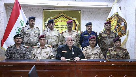 Iraqi Prime Minister Haider al-Abadi, center, surrounded by top military and police officers as he announces the start of the operation to liberate the northern city of Mosul from IS militants | AP