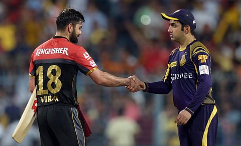 KKR captain Gautam Gambhir congratulates RCB captain Virat Kohli (L) after the 2016 IPL match between Kolkata Knight Riders and Royal Challengers Bangalore at the Eden Gardens in Kolkata. | AFP