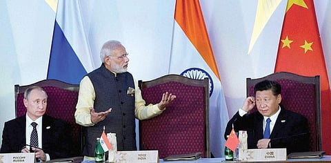 PM Narendra Modi, Russian president Vladimir Putin (left) and Chinese President Xi Jinping (right) at the BRICS summit in Goa
