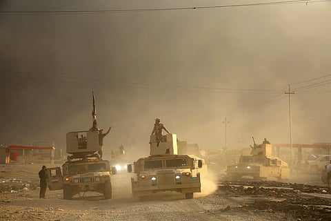 An Iraqi military convoy advances towards the city of Mosul, Iraq, Wednesday, Oct. 19, 2016. | AP