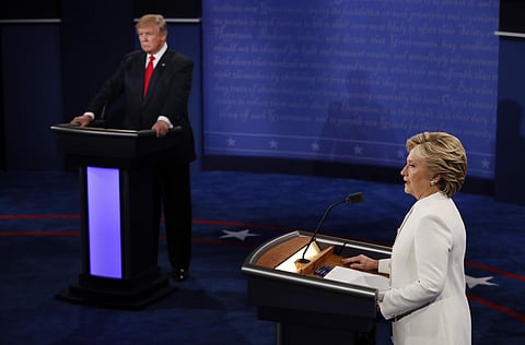 Democratic presidential nominee Hillary Clinton speaks as Republican presidential nominee Donald Trump listens during the third presidential debate at UNLV in Las Vegas, Wednesday, Oct. 19, 2016. | AP