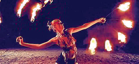 (Top) A Tanoura dancer (Below) Fire dancers during their act